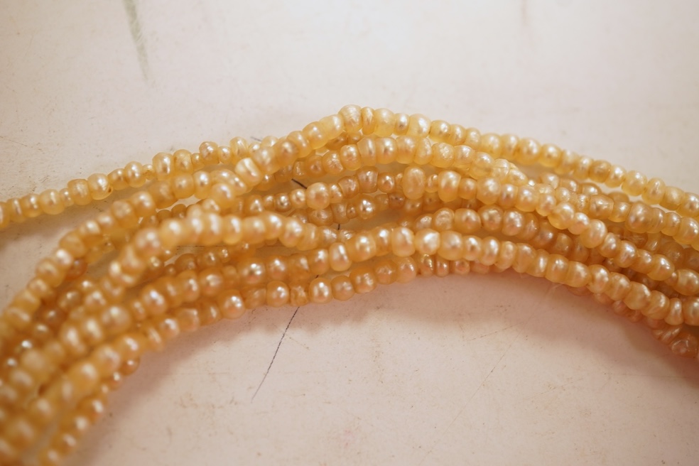 An eight-strand seed pearl choker necklace, with a rose-cut diamond clasp, length 34cm, pearls untested; together with a single strand graduated cultured pearl necklace, length 40cm, clasp stamped 9ct, Condition: good, s